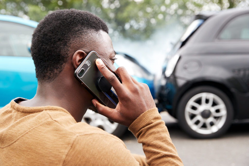 male,motorist,involved,in,car,accident,calling,insurance,company,or
